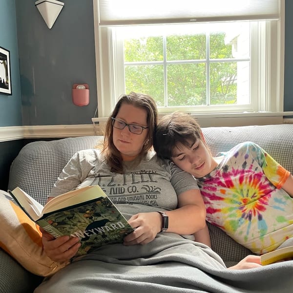 Woman reading a book in a cozy warm setting