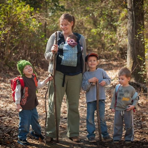 Mother babywearing in nature